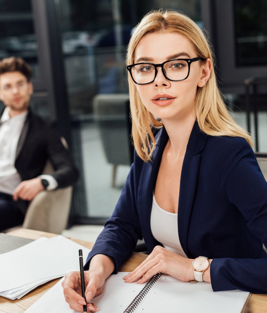 selective-focus-of-businessman-looking-at-businesswoman-in-eyeglasses-that-looking-at-camera-at.jpg selective-focus-of-businessman-looking-at-businesswoman-in-eyeglasses-that-looking-at-camera-at.jpg